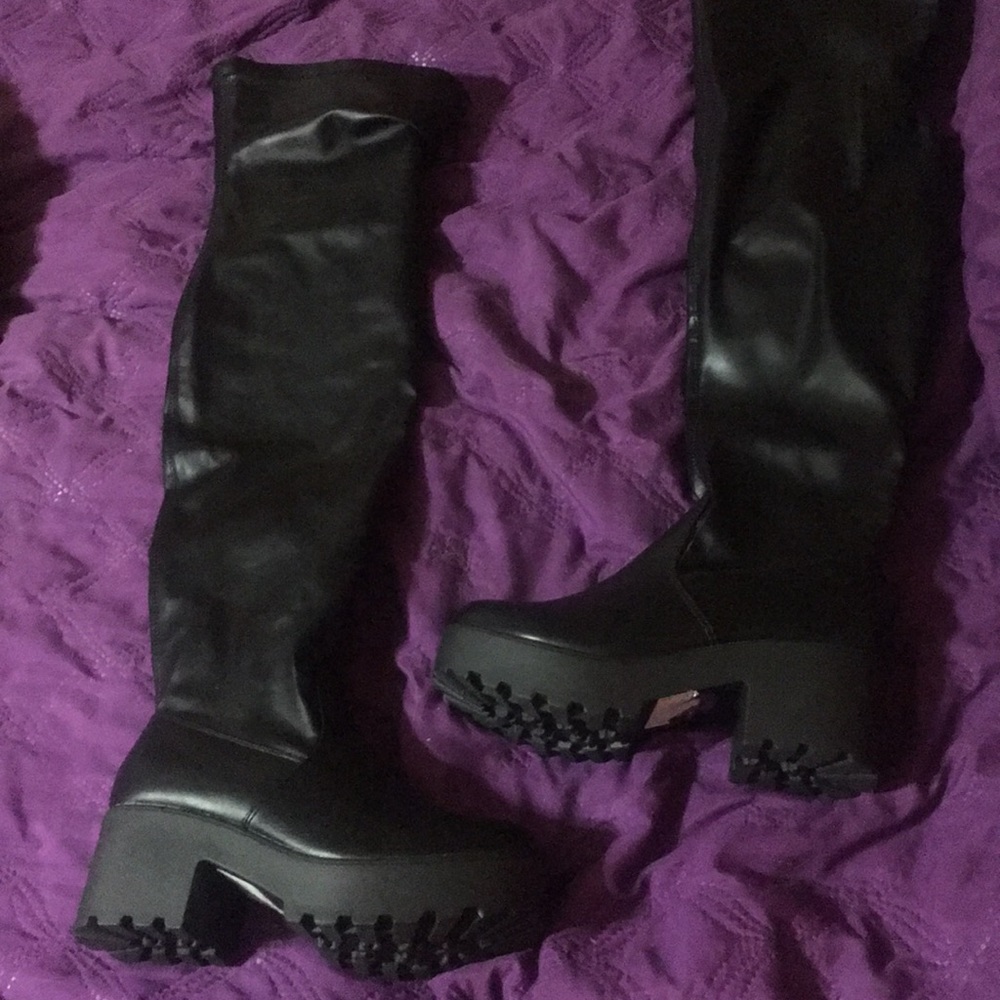 Thigh high black boots